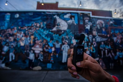 Use the camera during the filming of a mural
